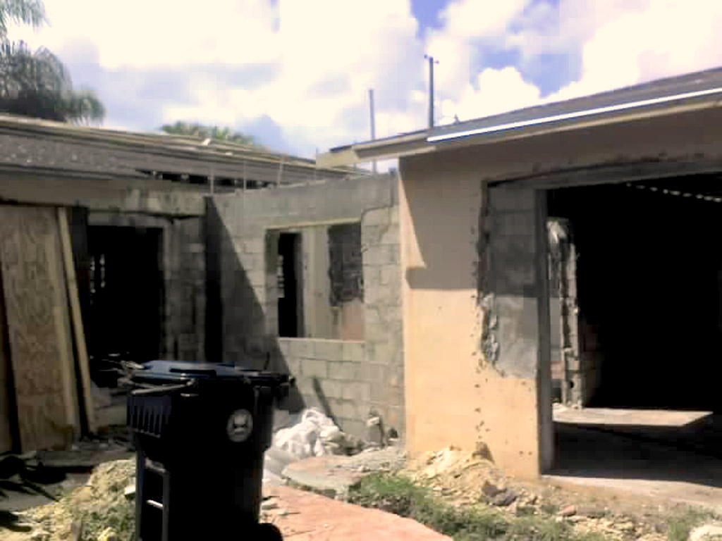 Detached garage with new connecting wall