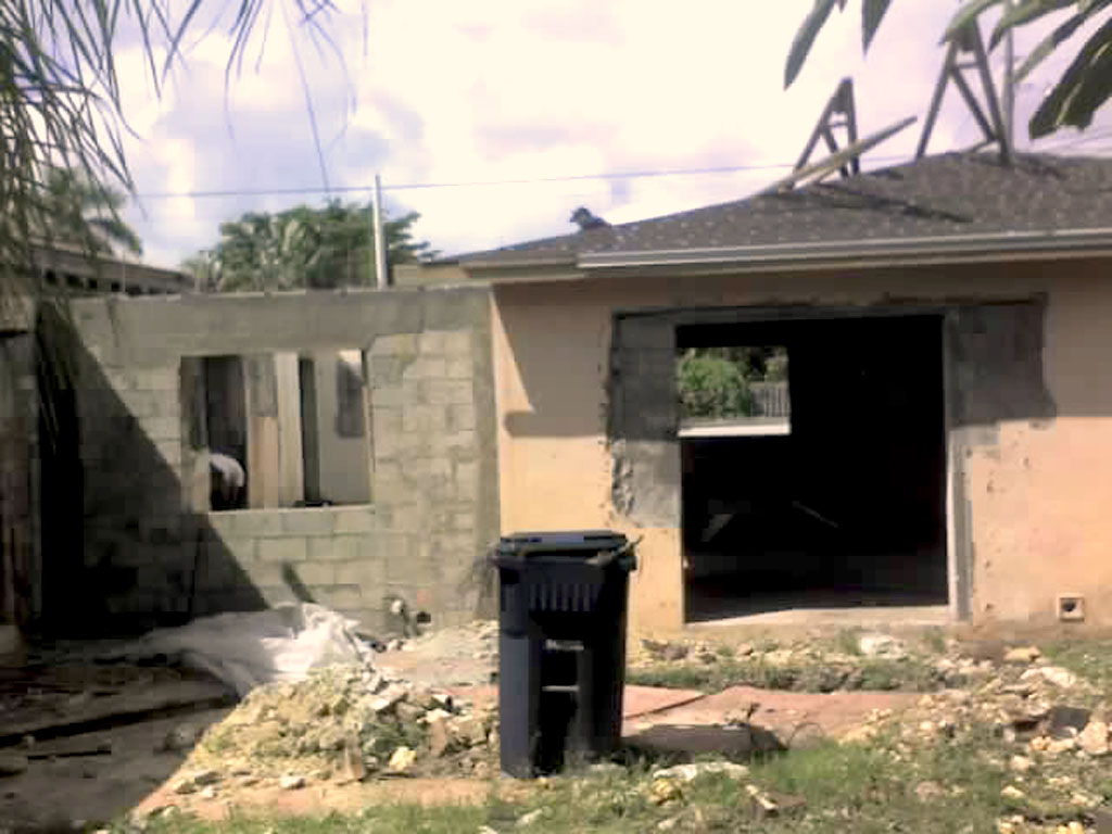 Detached garage with new connecting wall